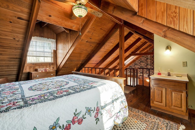 bedroom featuring dark hardwood / wood-style flooring, lofted ceiling with beams, ceiling fan, and wood ceiling