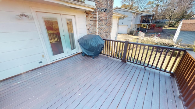 wooden deck featuring area for grilling