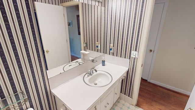 bathroom featuring vanity and hardwood / wood-style floors