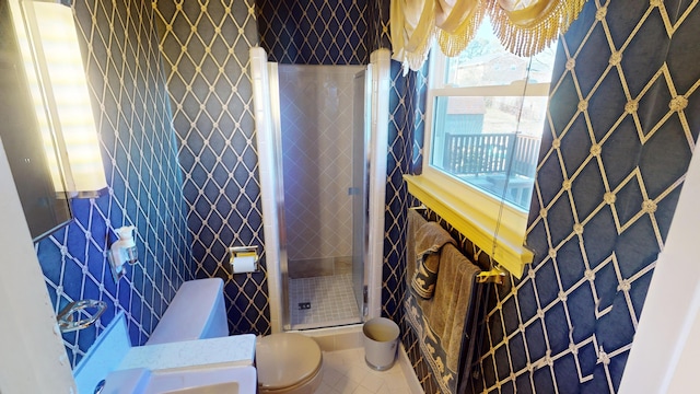 bathroom featuring toilet and tile patterned flooring