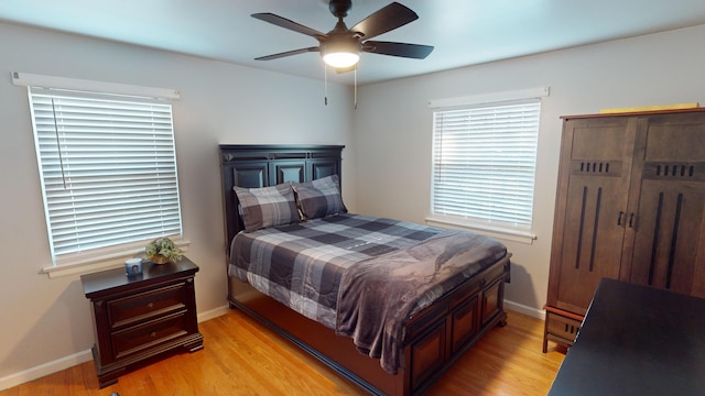 bedroom featuring light wood-type flooring and ceiling fan