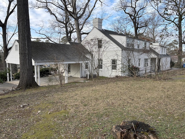 view of property exterior with a yard