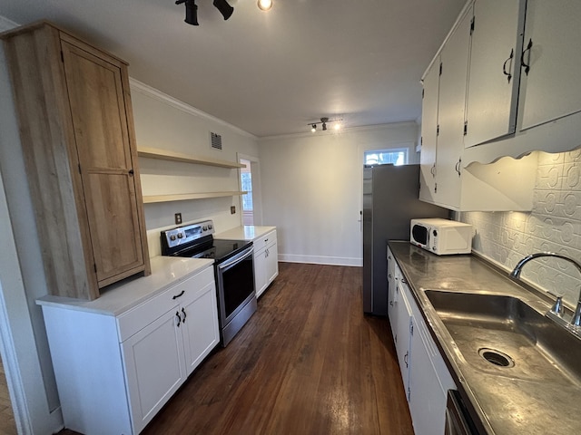 kitchen with electric stove, dark hardwood / wood-style floors, sink, a healthy amount of sunlight, and white cabinets