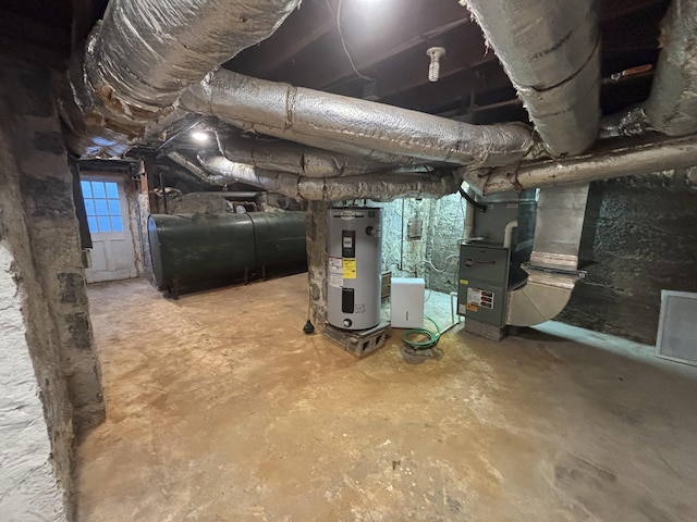 basement with water heater and heating unit