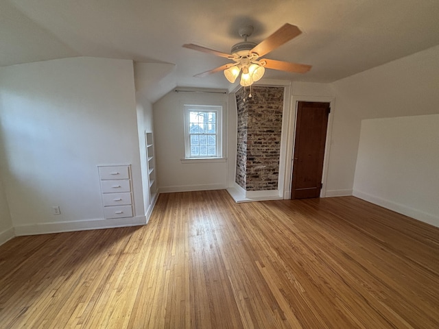 bonus room featuring vaulted ceiling, ceiling fan, and light hardwood / wood-style floors