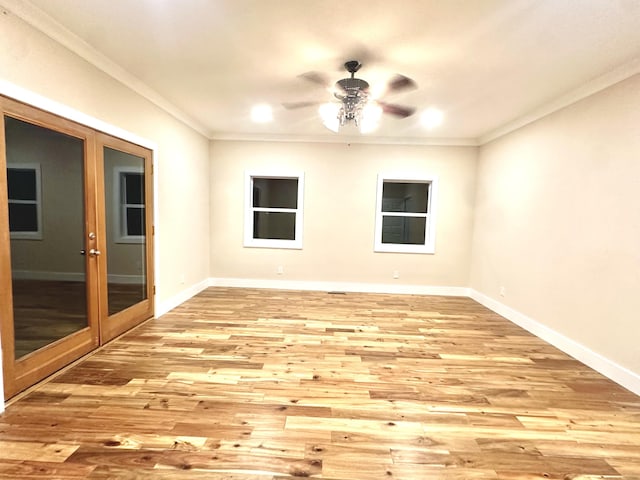 empty room with light hardwood / wood-style floors, crown molding, and ceiling fan