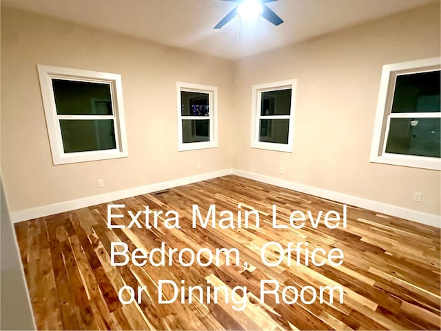 unfurnished room with ceiling fan and hardwood / wood-style floors