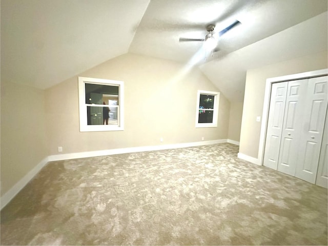 bonus room featuring vaulted ceiling, ceiling fan, and carpet