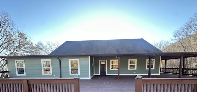 rear view of house with a wooden deck