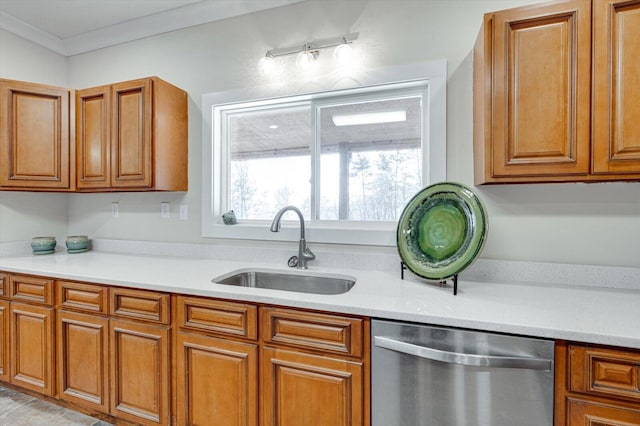 kitchen with sink, ornamental molding, and dishwasher