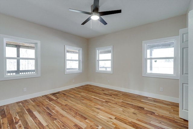 unfurnished room with ceiling fan and light hardwood / wood-style floors