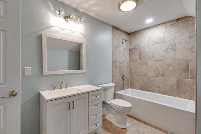 full bathroom featuring vanity, tiled shower / bath combo, tile patterned floors, and toilet