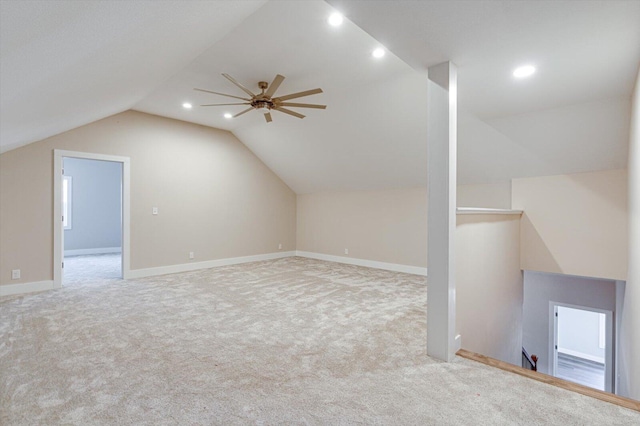 bonus room with ceiling fan, light colored carpet, and vaulted ceiling