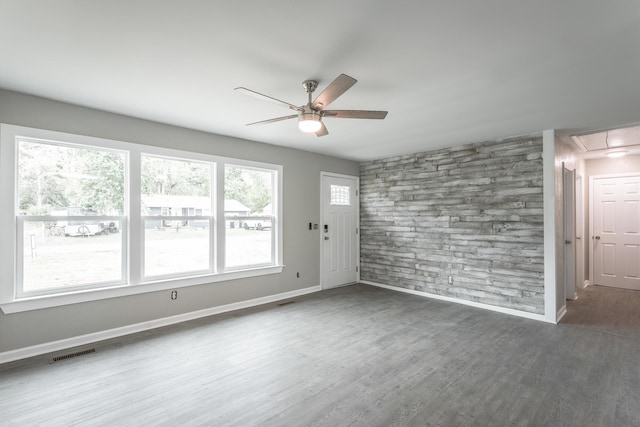 interior space featuring dark hardwood / wood-style flooring and ceiling fan