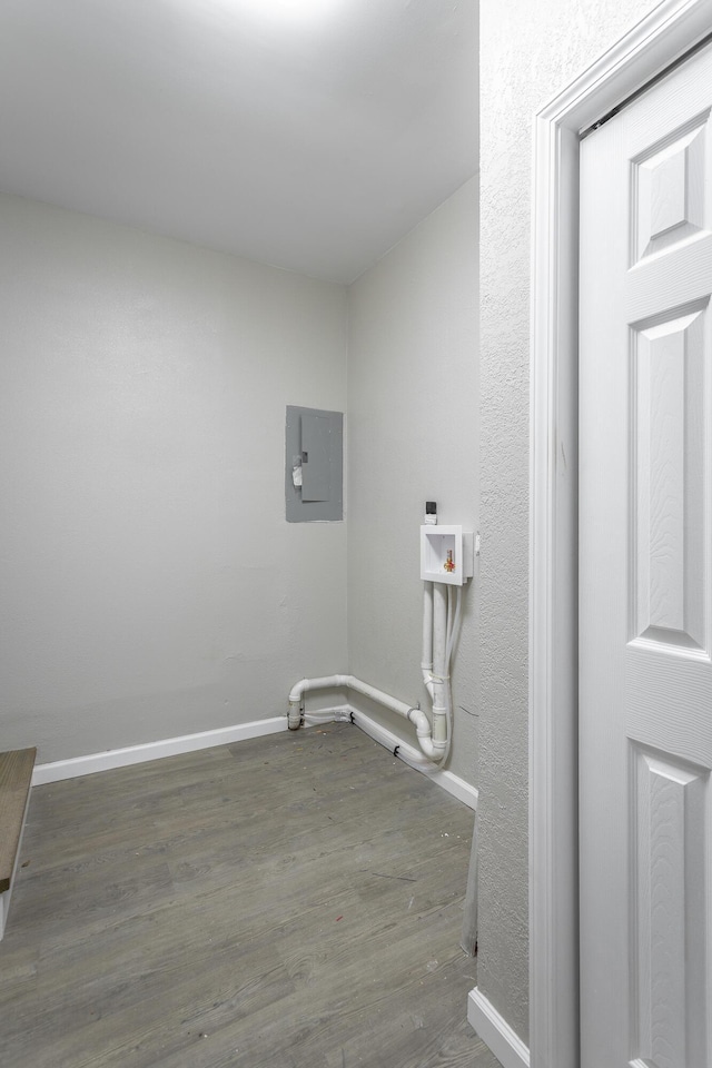 washroom with dark wood-type flooring, washer hookup, and electric panel