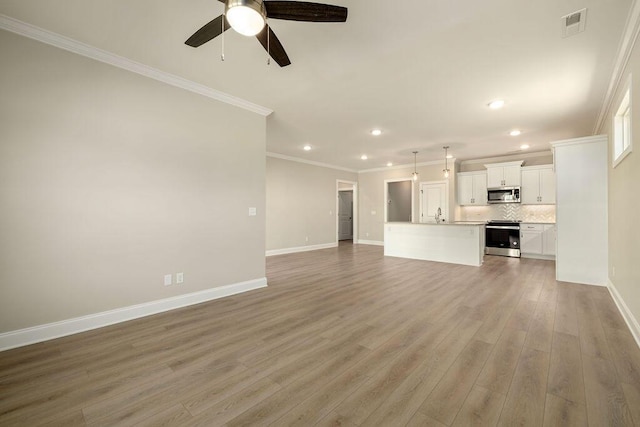 1691 Whisper Winds Ln Unit 35, Ooltewah, TN 37363 - unfurnished living room with ornamental molding, recessed lighting, ceiling fan, and light wood-style floors