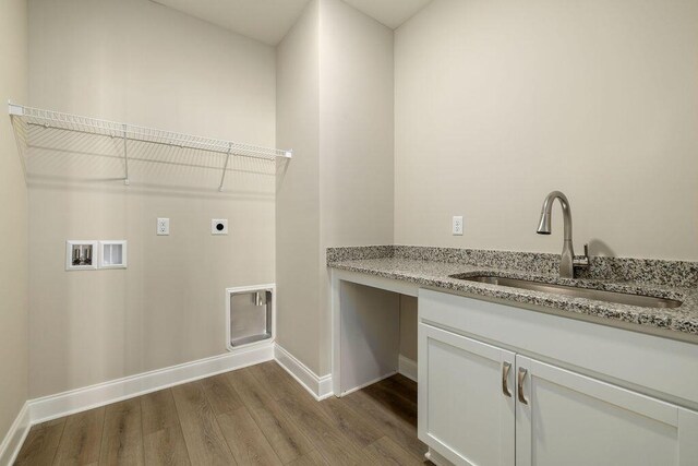 1691 Whisper Winds Ln Unit 35, Ooltewah, TN 37363 - laundry area featuring hookup for an electric dryer, dark wood-style floors, hookup for a washing machine, and cabinet space
