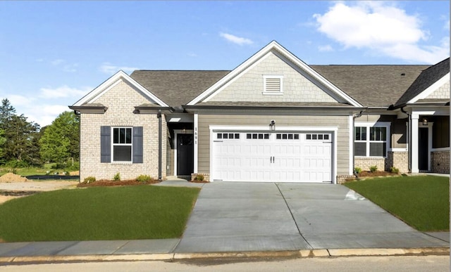 1691 Whisper Winds Ln Unit 35, Ooltewah, TN 37363 - craftsman-style home with an attached garage, driveway, a front lawn, and brick siding