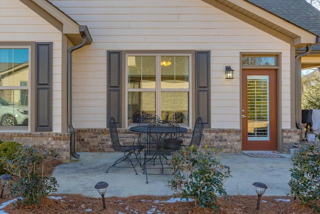 property entrance with a patio