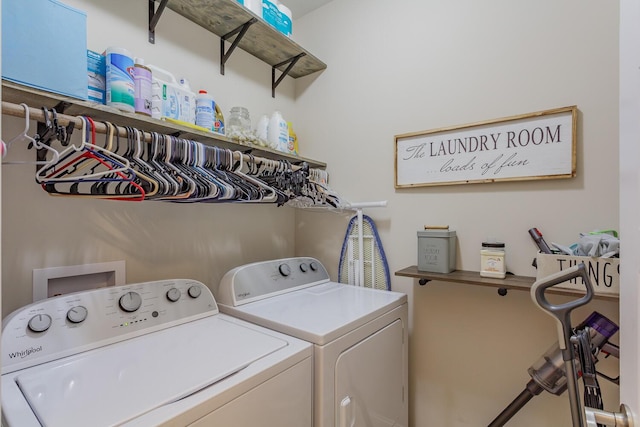 clothes washing area with washer and clothes dryer