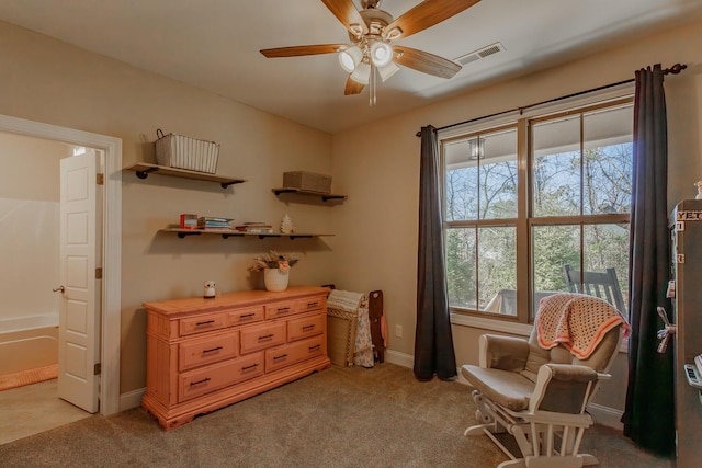 sitting room with light carpet and ceiling fan