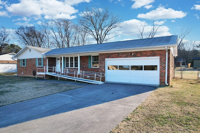 ranch-style house with a front lawn, a garage, and covered porch