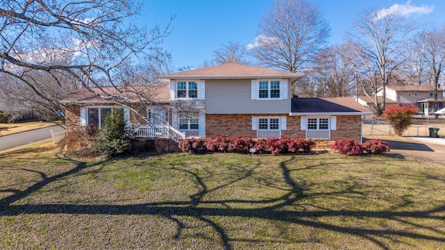 split level home with a front yard