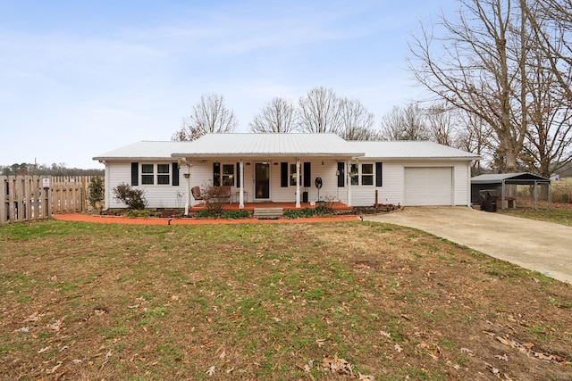 ranch-style home featuring covered porch, a garage, a carport, and a front lawn