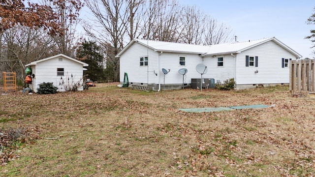 back of property featuring a yard