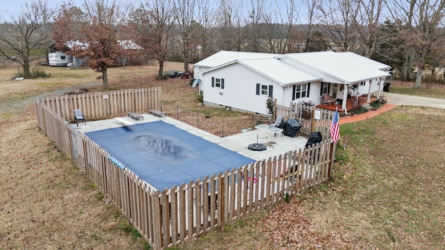 view of pool featuring a patio area and a lawn