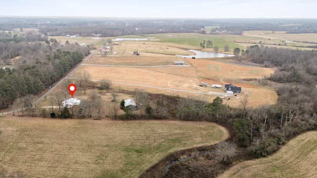 aerial view with a rural view and a water view