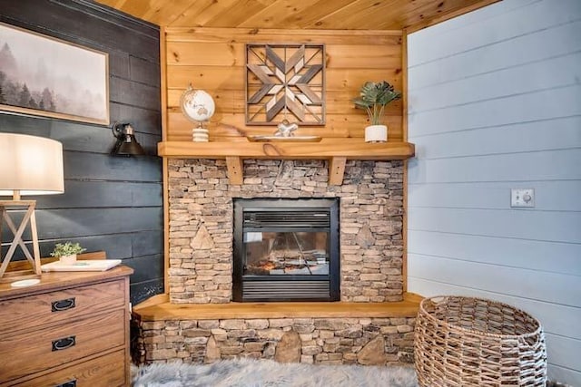 room details with wooden ceiling, wooden walls, and a fireplace