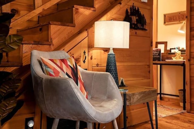 interior space featuring light hardwood / wood-style floors and wood walls