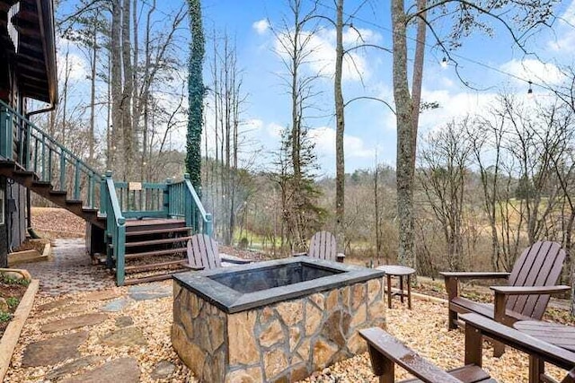 view of patio featuring an outdoor fire pit