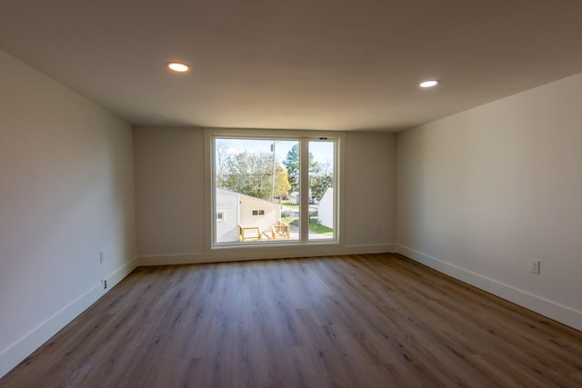 empty room with wood-type flooring