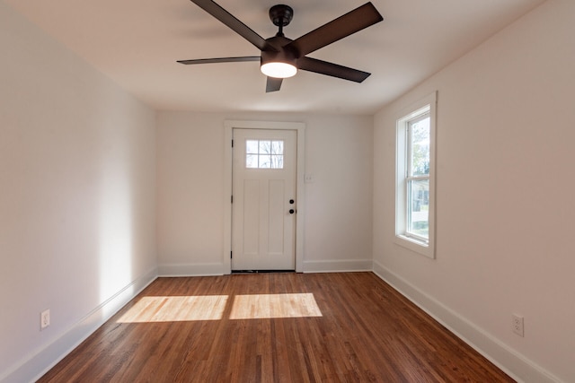 entryway with ceiling fan, a wealth of natural light, and hardwood / wood-style floors