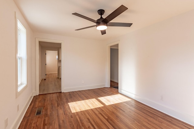 spare room featuring ceiling fan and hardwood / wood-style floors