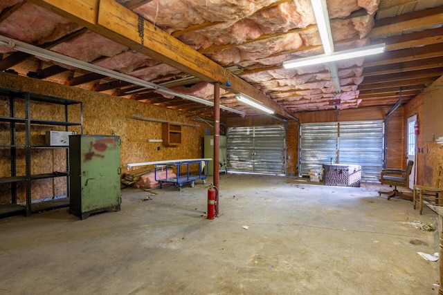 garage featuring secured water heater