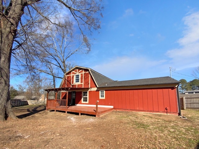 back of property featuring a deck