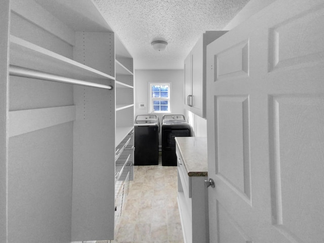 spacious closet featuring washer and dryer