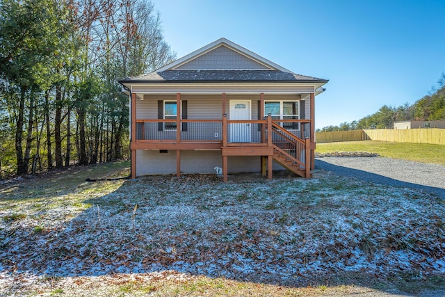 rear view of property with covered porch