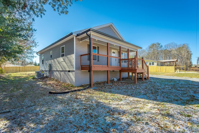 rear view of house with central AC