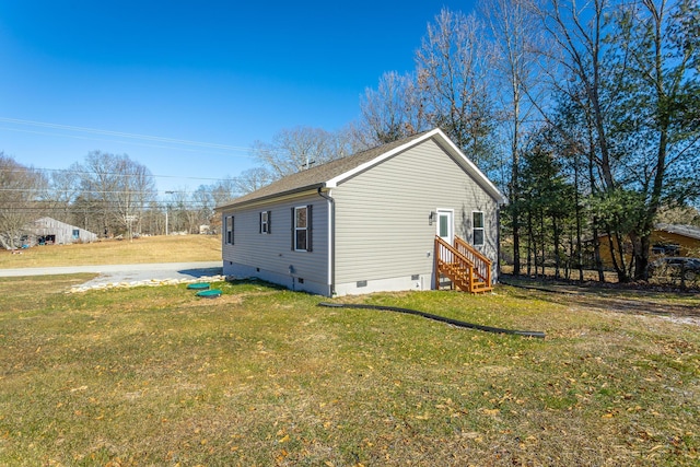 view of property exterior with a lawn