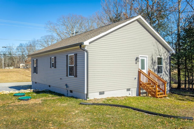 view of home's exterior with a lawn