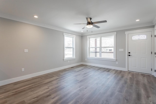 foyer with ceiling fan, dark hardwood / wood-style flooring, and crown molding