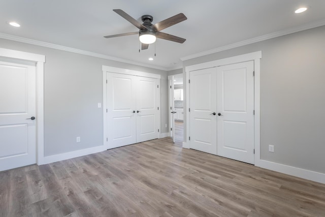 unfurnished bedroom with ceiling fan, crown molding, and light hardwood / wood-style floors