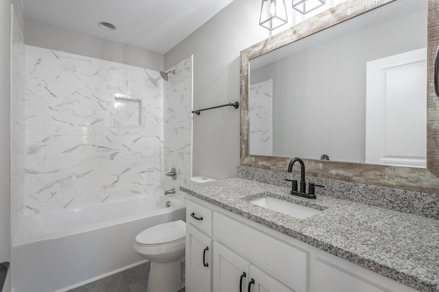 full bathroom with toilet, tiled shower / bath combo, and vanity