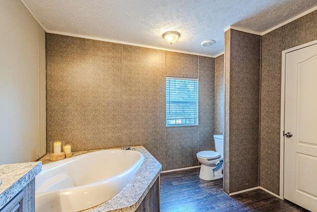 bathroom with hardwood / wood-style flooring, a bathing tub, ornamental molding, a textured ceiling, and toilet