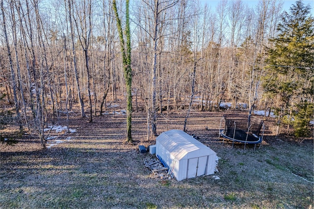 view of yard with a trampoline