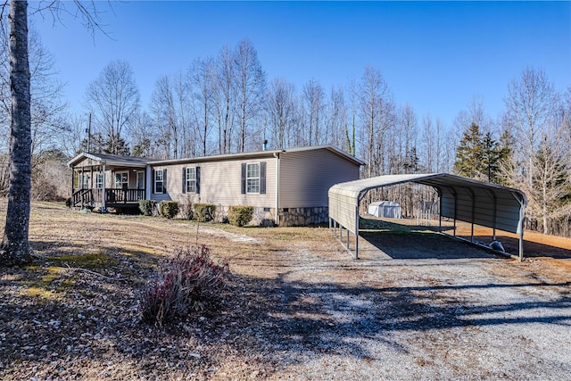 view of front of house with a carport and covered porch